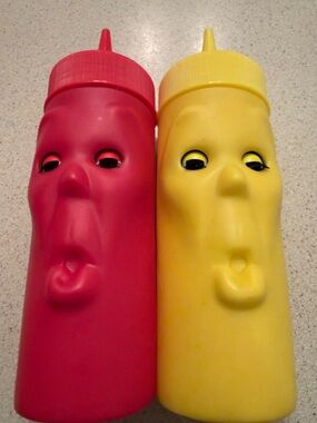 Kikkerland Red and Yellow Face Squeeze Condiment Bottles